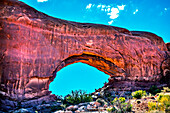 North window Arch Windows Section Arches National Park, Moab, Utah, USA. Red canyon walls and blue skies.