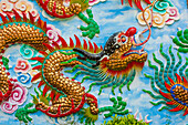Bangkok, Thailand. Colorful relief of dragon or serpent.