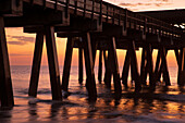USA, Georgia. Silhouette of a pier in the sunrise, near Savannah.
