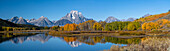 USA, Wyoming. Reflection of Mount Moran and autumn aspens at the Oxbow, Grand Teton National Park.