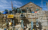 Fishing Nets And Traps On Stone Wall