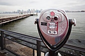 Binoculars looking onto Hudson River; New York City, New York, United States of America