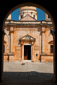 Greece, Crete, Cats Walking past Church of Agia Triada Monastery; Akrotiri Peninsula