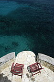 Looking Down To Deck Chairs Beside The Sea, The Caves, Negril, Jamaica.
