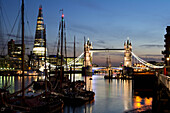 United Kingdom, City skyline with Tower Bridge and Shard building at dusk; London