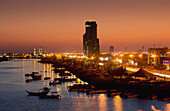 United Arab Emirates, View of city skyline at dusk; Ras Al Khaimah