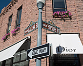 USA, Colorado, Downtown shopping district; Aspen, Dior store on corner of Galena St and Hopkins Ave