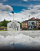 United Kingdom, Northern Ireland, County Londonderry, Reflected view of murals in Bogside Area; Derry