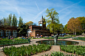 People Sunbathing On A Spring Day In Holland Park, West London, London, Uk