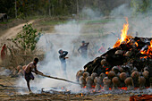 A Fire Burning Items Producing Smoke, Potters Village; Madhya Pradesh, India