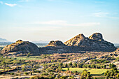 Farmland surrounding a dam lake and the desert landscape at the Aravali Hills in the Pali Plain of Rajasthan; Rajasthan, India