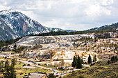 Overview scenic of the Liberty Cap and Palette Spring area with its travertine terraces in Mammoth Hot Springs, Yellowstone National Park; Wyoming, United States of America