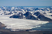 Aerial of tidewater glacier and fjord, Spitsbergen, Svalbard, Norway.