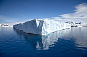 The corner of a tabular iceberg in the ocean.