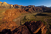 View of the Colorado River from a canyon ledge.