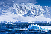 Icebergs and mountains near Cuverville Island, Antarctica.