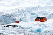 Argentinian research station at water's edge of Antarctic peninsula.