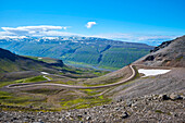 View of the mountain pass road to the summit of Hellisheiði Eystri; Ketilsstadhir, Austurland, Northern Region, Iceland