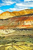 Ancient, eroded cliffs in an arid scene near Bosque Petrificado Jose Ormachea, a petrified forest near Comodoro Rivadavia; Patagonia, Argentina