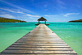 A jetty at a tropical beach resort in the Caribbean.; Canouan Island, the Grenadines, St Vincent and the Grenadines, in the Caribbean.