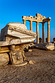 Roman and Hellenistic ruins of the Temple of Apollo under a bright blue sky at sunrise, a ruined Roman entrance, at Side, near Manavgat, on the Mediterranean coast of Anatolia; Side, Anatolia, Turkey