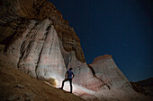 A man looks up at Red Rocks in the eastern Sierra Nevada Mountains.