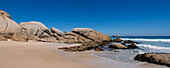 Sandy beach with large granite boulders and rock formations at Clifton Beach along the Atlantic Ocean in Cape Town; Cape Town, Western Cape, South Africa