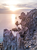 Dramatic rock formations on the coast of Lands End at sunset; Cabo San Lucas, Baja California Sur, Mexico