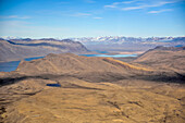 From the window of the plane, one final view out over lake Centrum S??, base camp and in the distance, 'Mars' and the route we hiked with enormous bags of equipment all those days ago. For two weeks, this small area of Greenland was our home. Will we ever return...; Northeast Greenland , Greenland