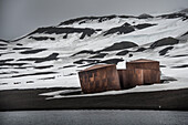 Deception Island in the South Shetland Islands archipelago is a natural harbor.  Rusting tanks used to store blubber from the whaling era are still standing; Antarctica