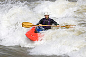 Kayaker paddles through white-water rapids in the Potomac River.; Potomac River - Maryland/Virginia, USA