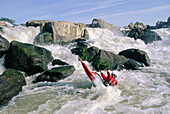 Kayaker in rapids at Great Falls on the Potomac River.; GREAT FALLS, POTOMAC RIVER.