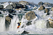 Kayaker running Great Falls on the Potomac River in winter.; GREAT FALLS, POTOMAC RIVER.