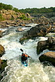 Kayaker running waterfalls at Great Falls.; Potomac River, Virginia/Maryland.