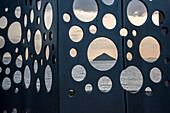 Ocean views through holes of a modern sculpture, art installation on Naoshima Island, an island in the Seto Inland Sea that is known for its modern art museums, architecture and sculptures. Much of Naoshima's art was installed by the Benesse Corporation, which oversees art museums, installations and sculptures both on Naoshima and on neighboring islands; Naoshima Island, Seto Inland Sea, Japan