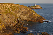 Godrevy Lighthouse on Godrevy Island seen from the rocky cliffs at the eastern tip of St Ives Bay, Near St Ives; Godrevy Island, Cornwall, England, Great Britain