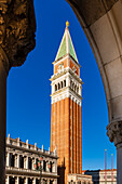 View of St Mark's Campanile through an archway in Piazza San Marco in Veneto; Venice, Italy
