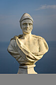 Close-up of a marble bust with ocean background along The Terrace of Infinity at Villa Cimbrone; Ravello, Salerno, Italy