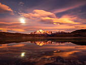 Supermoon reflection at sunrise in Lago Azul, Torres del Paine National Park; Patagonia, Chile