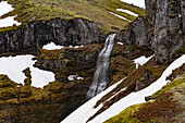 A hikers paradise, Mulagljufur Canyon with a close-up view of a waterfall against the rocky cliffs; Vik, South Iceland, Iceland