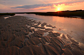 Sunrise over Payne's Creek estuary and tidal flats in Brewster, Cape Cod.; Brewster, Massachusetts, USA.