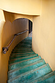 Green Steps Going Up A Yellow Walled Stairwell; Sayulita Mexico