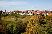 Trees And Buildings Against A Blue Sky; Rothenburg Ob Der Tauber Bavaria Germany
