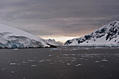 Mountains Along The Coastline At Sunset; Antarctica