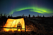 Trappers Tent Lit Up With Aurora Borealis At Wapusk National Park In Canada's North Near Churchill; Manitoba Canada