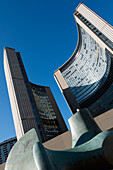 Low Angle View Of Two Curved Buildings Against A Blue Sky; Toronto Ontario Canada