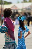 A Woman And Girl Dressed Up For The April Fair; Seville Andalusia Spain