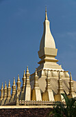 Laos, Vientiane, Pha That Luang, Architectural detail of a golden rooftop.