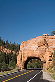 USA, Utah, Dixie National Forest, Red Canyon, Claron Limestone Formations, Tunnel cut through rock formation for road.