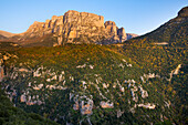 The Setting Sun Lights Up The Astraka Or Papigo (Papingo) Towers With The Village Of Vikos Perching On Top Of The Ridge Below